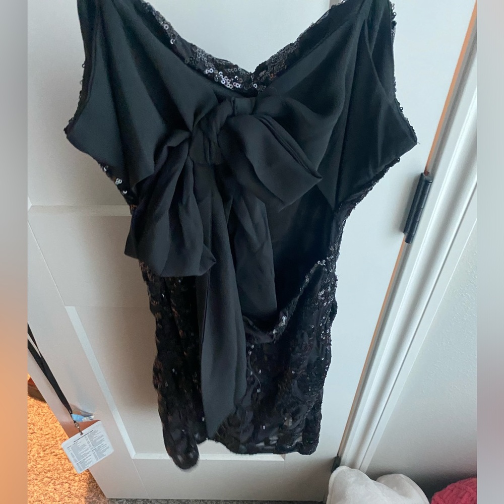 A black, short formal dress. Worn once!!! in perfect condition